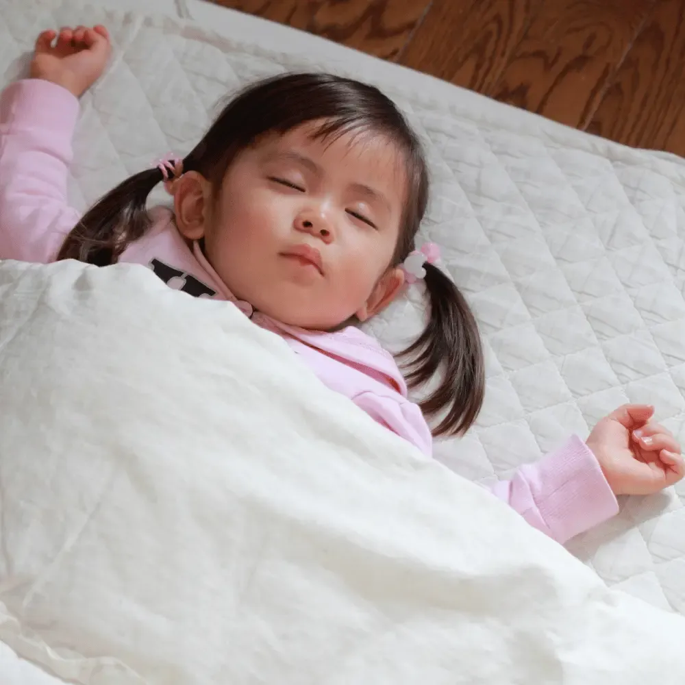 Toddler girl napping peacefully