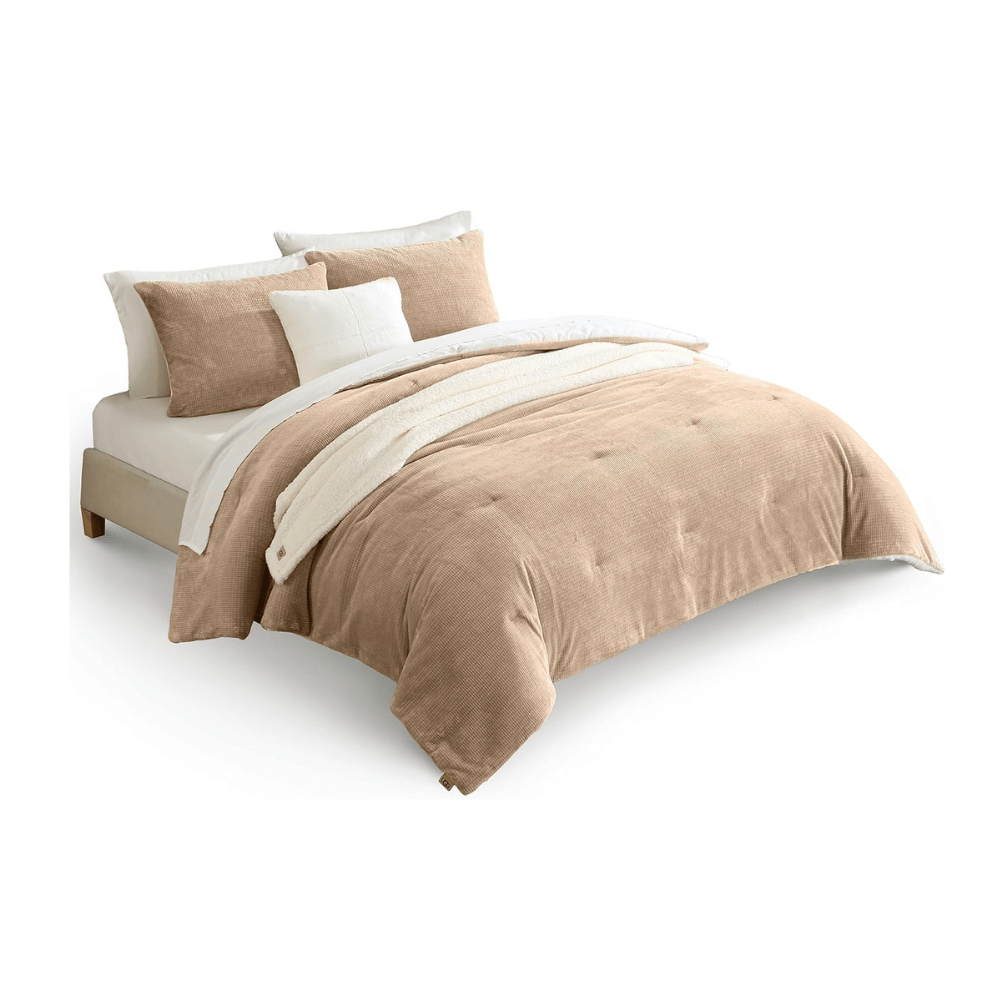 UGG Comforter Set in beige with matching pillows on bed (Credit: UGG / Amazon)