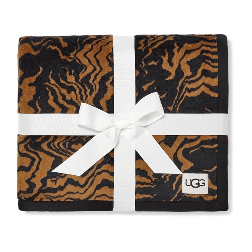 Folded UGG Duffield Throw II in tiger pattern with gift ribbon (Credit: UGG / Amazon)