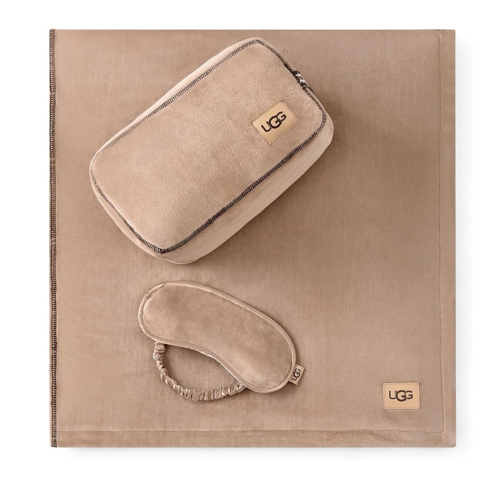 Flat lay of UGG Reagan Travel Set with mask and pouch (Credit: UGG / Amazon)