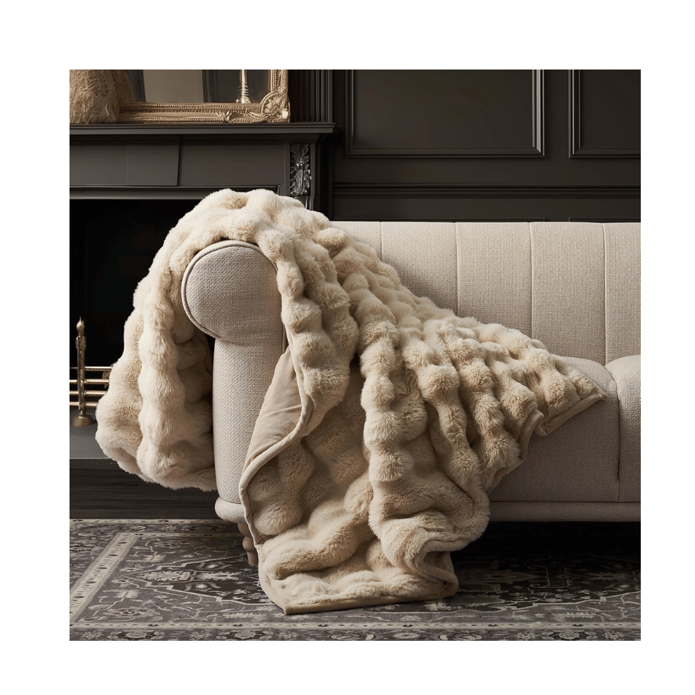 Cream EverGrace Rabbit Fur Blanket draped over sofa, highlighting bubble texture and reversible faux fur softness.