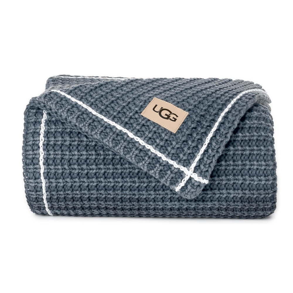 Folded UGG Luna Knit Throw Blanket in blue waffle texture (Credit: UGG / Amazon)