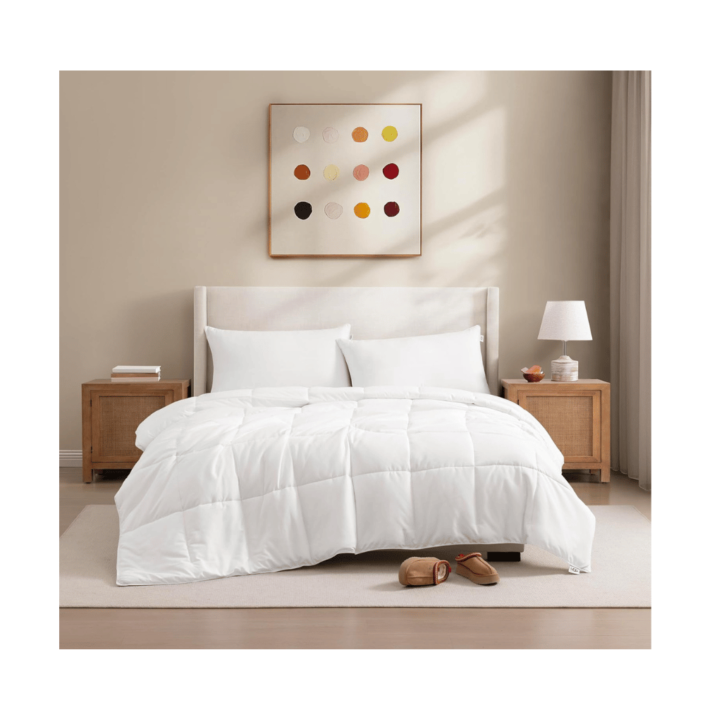 UGG Cooling Down Alternative Comforter on bed in neutral bedroom (Credit: UGG / Amazon)