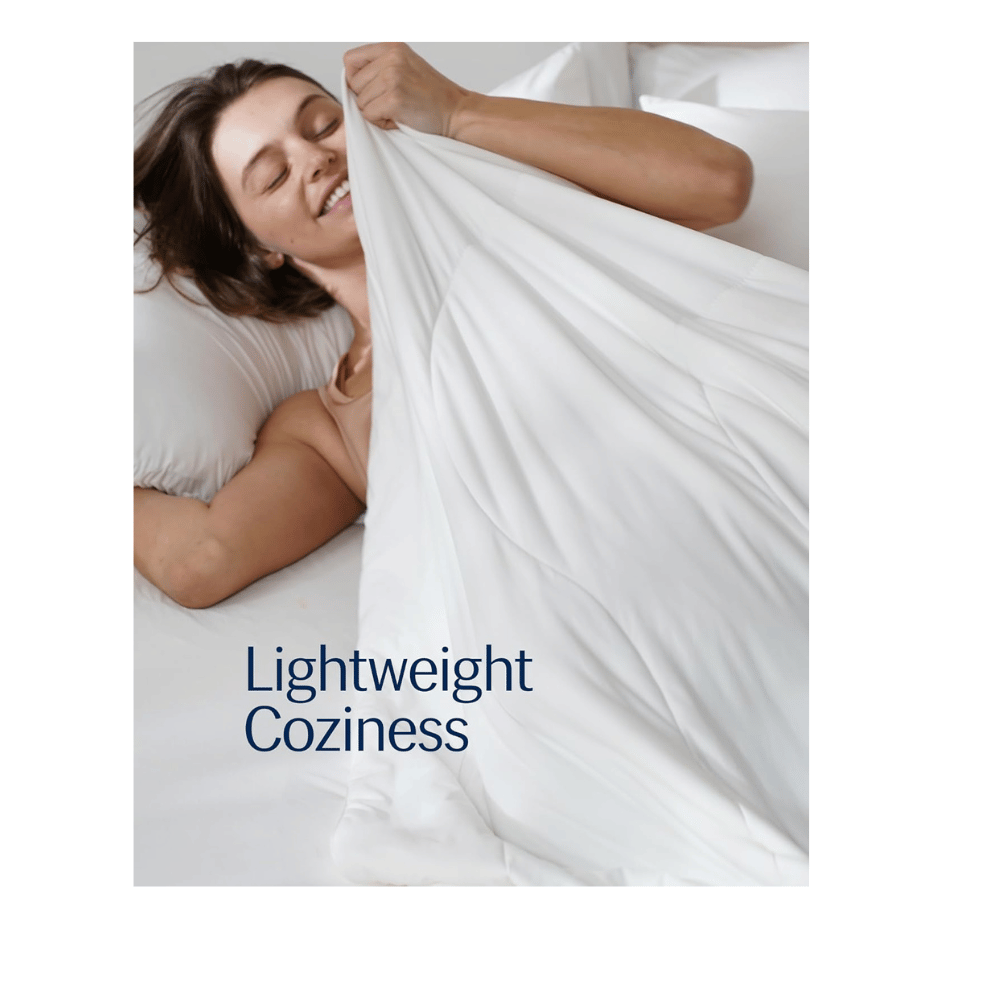 Woman enjoying lightweight REST Evercool Comforter, demonstrating cooling technology and soft, breathable texture.