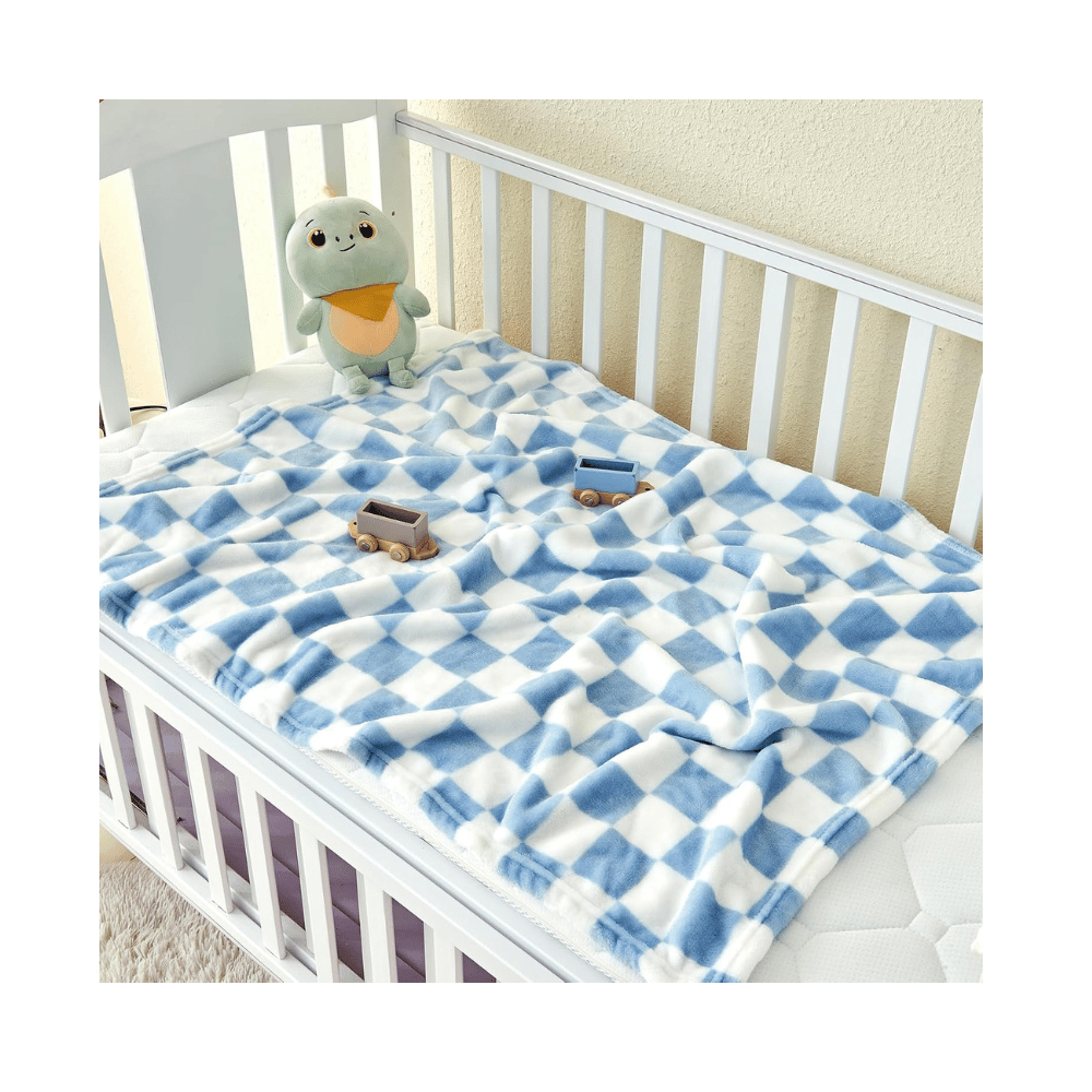 Soft blue white crib blanket.