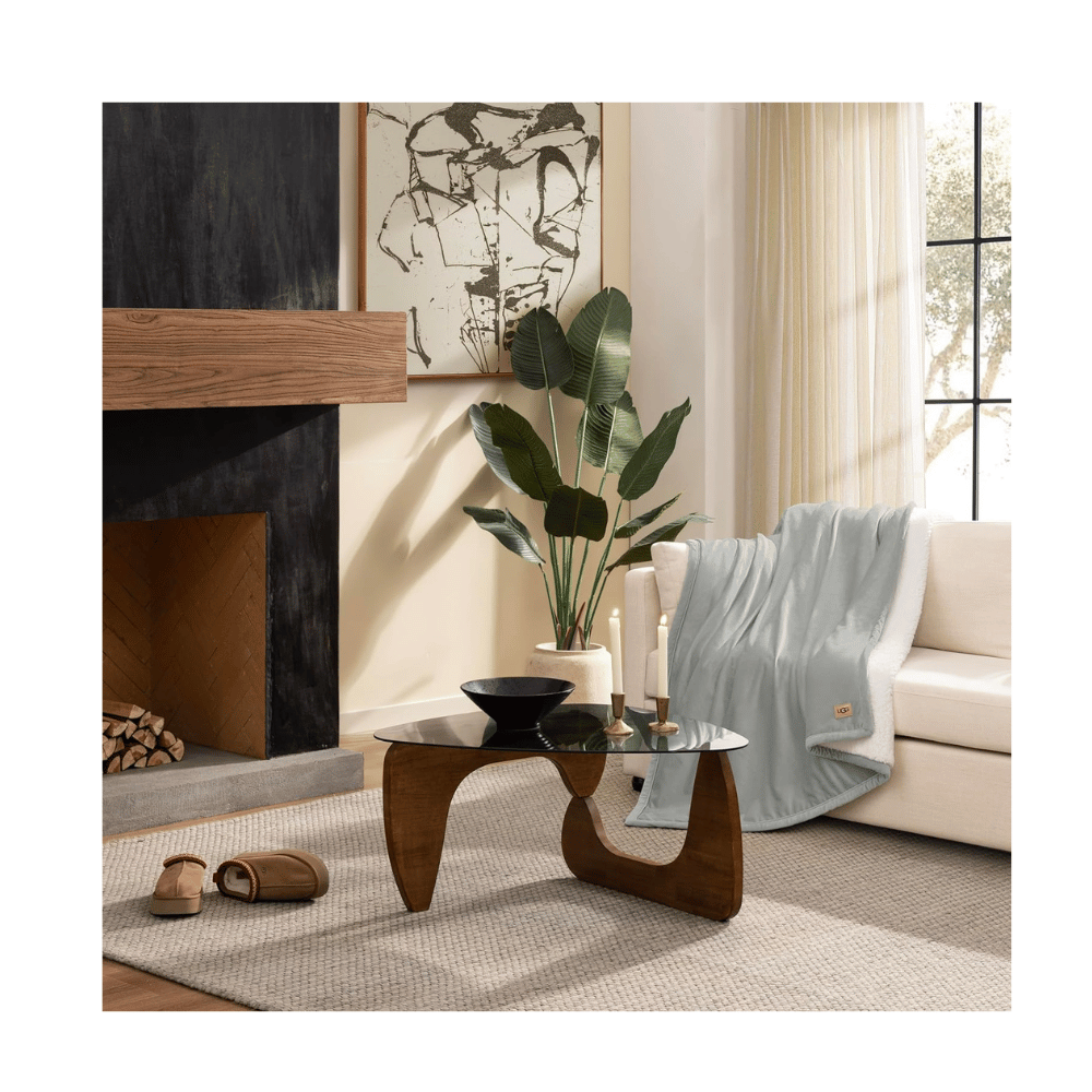 Close-up of UGG Bliss Throw Blanket texture showing plush reversible sherpa material (Credit: MyRadiantSleep.com)