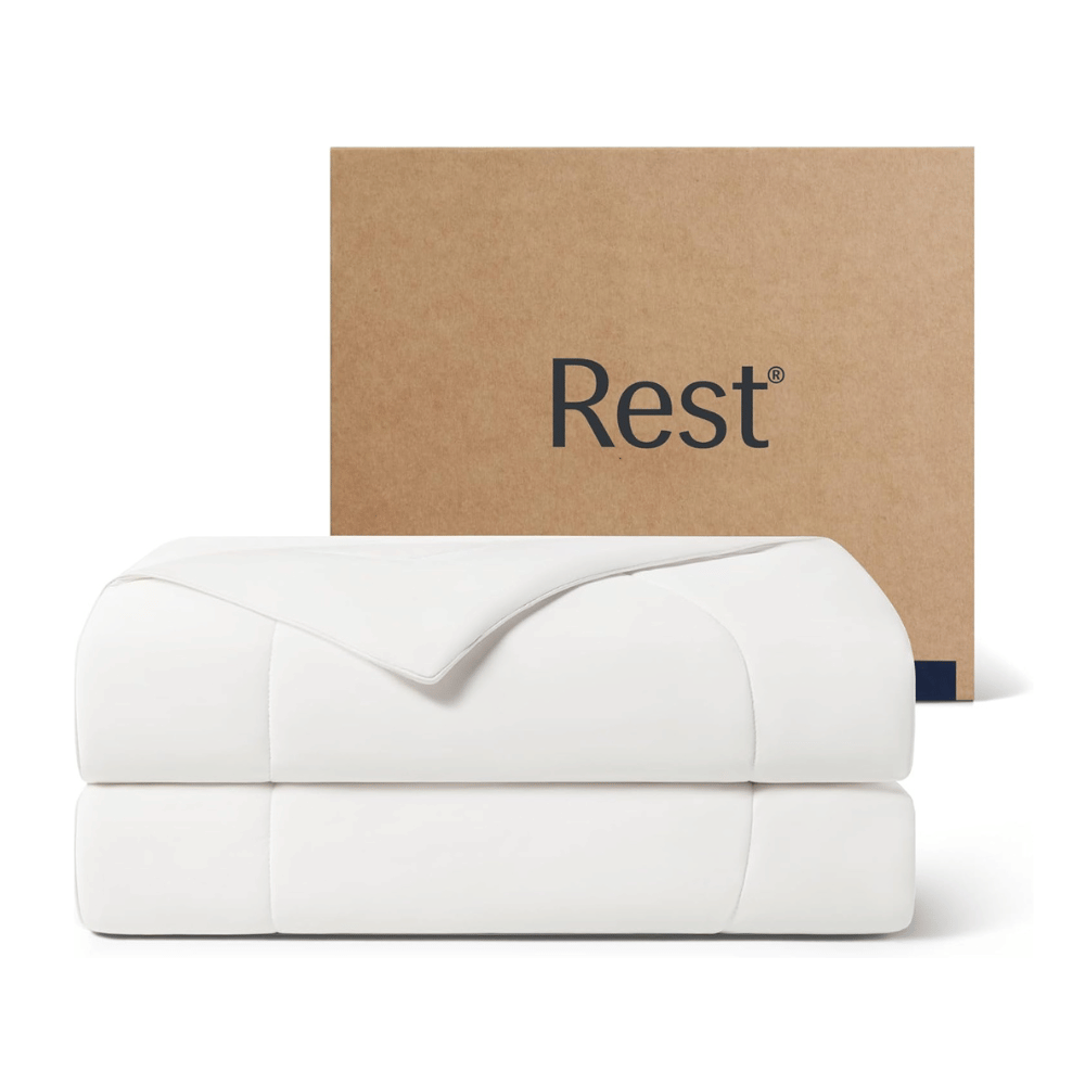 REST Evercool Cooling Comforter folded neatly with box packaging, showing smooth cooling fabric and minimalist design.