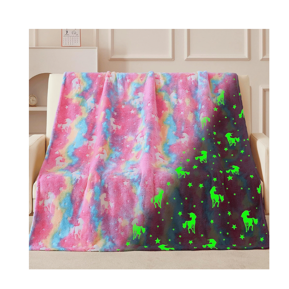 Pink unicorn glow blanket shines.