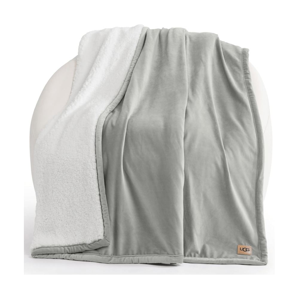 UGG Bliss Throw Blanket folded showing reversible sherpa and velvety fabric design (Credit: MyRadiantSleep.com)