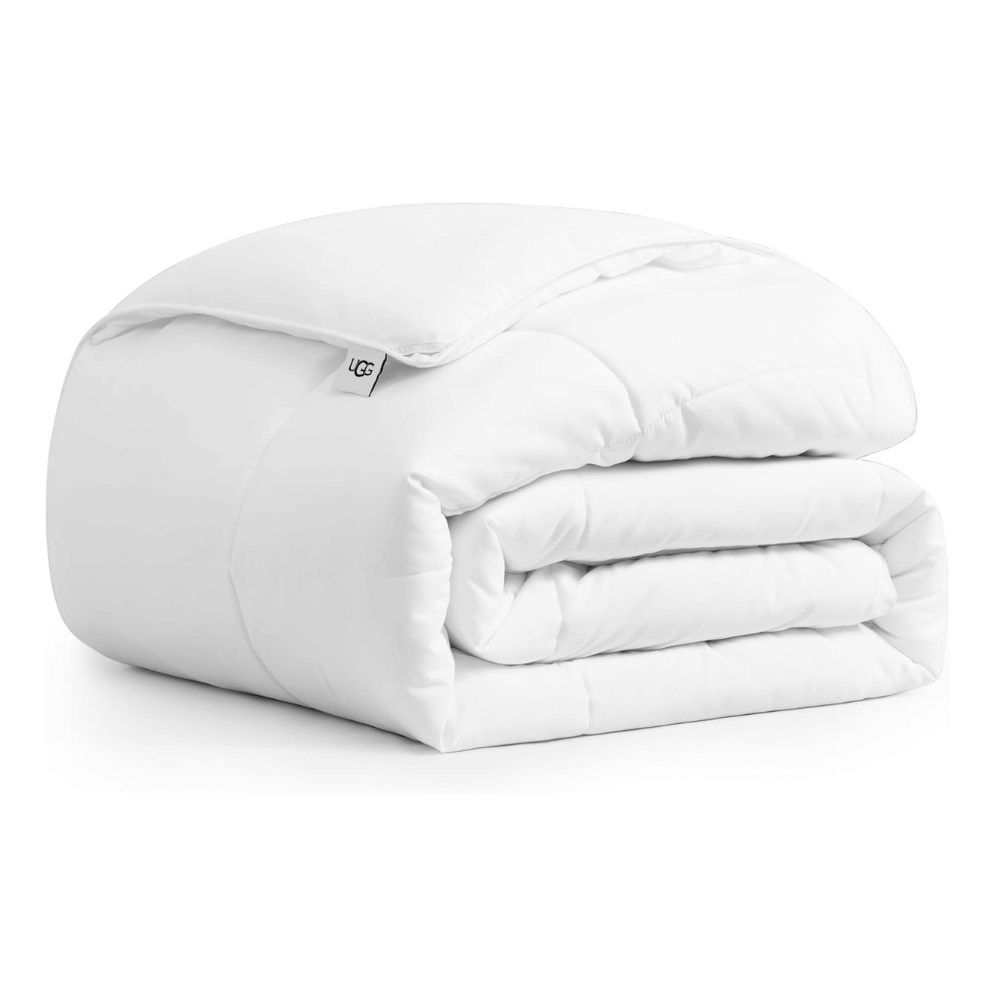 Folded UGG Cooling Down Alternative Comforter in white for breathable sleep (Credit: UGG / Amazon)
