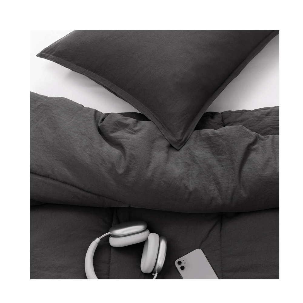 Close-up UGG Down Alternative Comforter with charcoal fabric texture (Credit: UGG / Amazon)