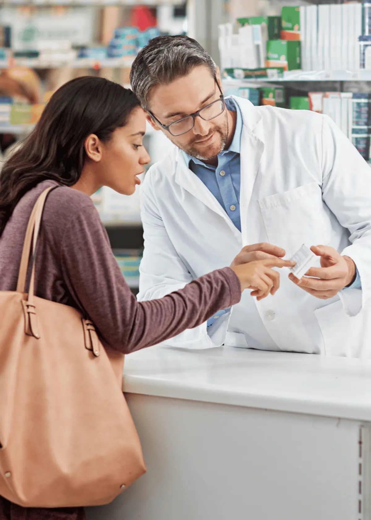 Customer consulting pharmacist about effective OTC sleep aid options